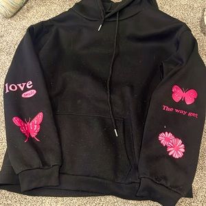 A black graphic design SHEIN hoodie, worn a few times